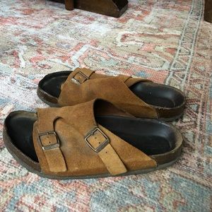 Well loved Birkenstock size 10. They definitely have wear and tare on them.